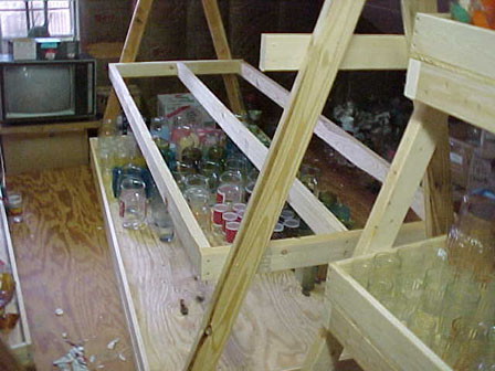 Add a shelf and begin filling it with glass.